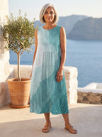 Marisol vestido degradado turquesa, terraza junto al mar